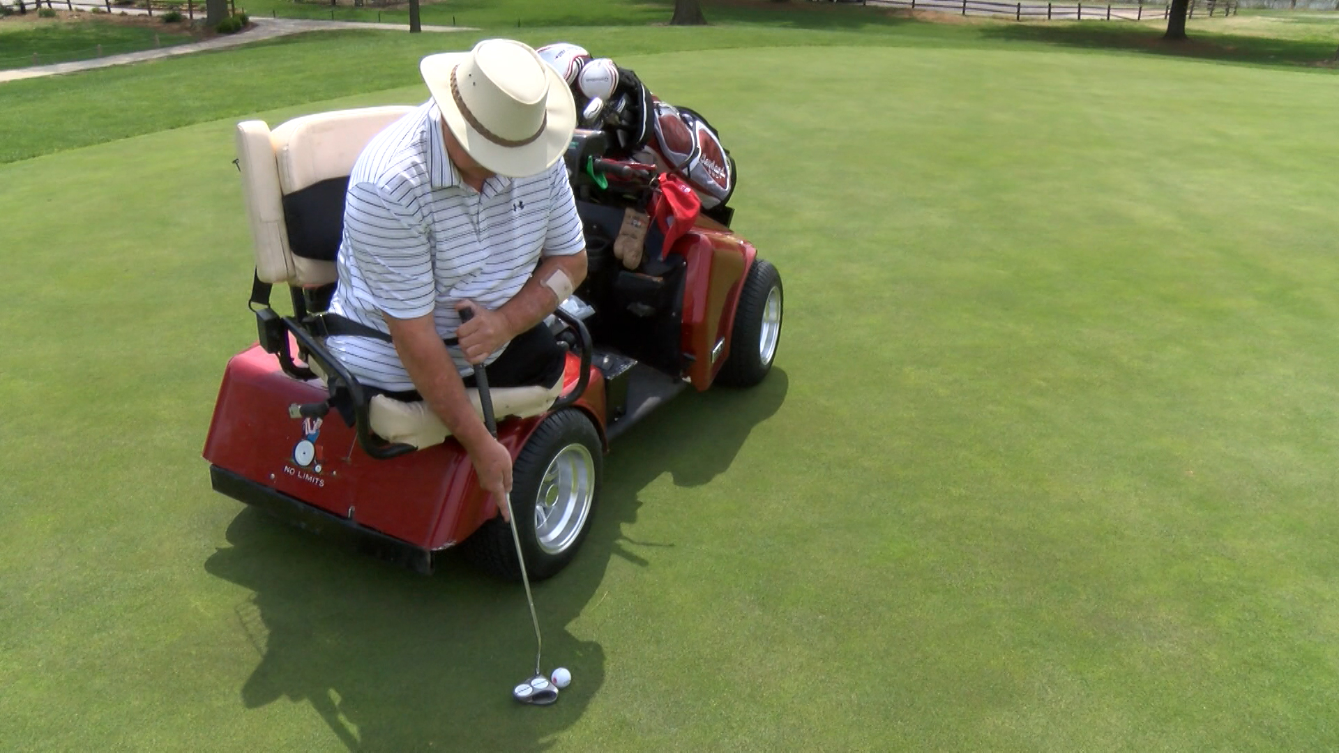 Open Vietnam veteran Gary York's single-rider cart is designed to drive onto greens and teeing grounds without damaging turf.